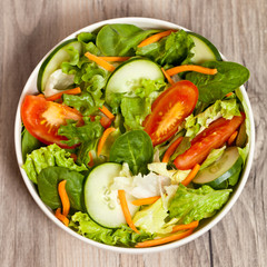 Fresh salad with tomato, cucumber and carrots