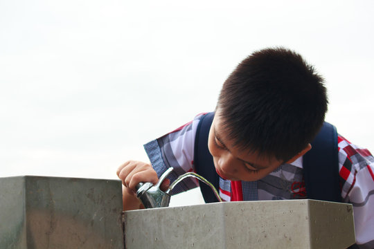 Boy Drinking From Outdoor Water A Fountain.