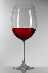 Glass of wine on gray background