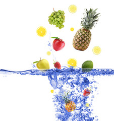 Fototapeta na wymiar Fresh fruits dropped into water