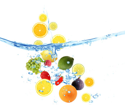 Fresh fruits dropped into water