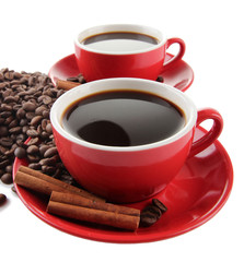 Red cups of strong coffee and coffee beans close up