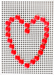 red heart made of red pins