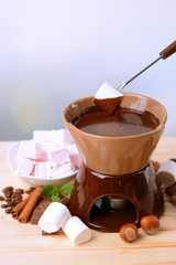 Chocolate fondue with marshmallow candies,