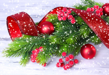 Fototapeta na wymiar Christmas balls on fir tree, on wooden background