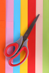 Colorful cardboard and scissors close-up
