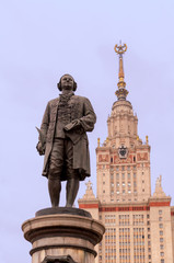 Fototapeta na wymiar Mickhail Lomonosov statue and Moscow State University building