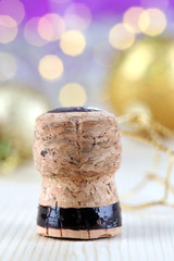 Champagne cork on Christmas lights background