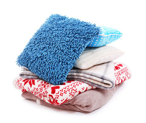Colorful pillows and plaids isolated on white