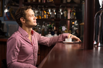 man with a cup of coffee