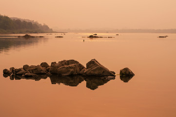 Rocks and river at Sunset