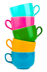 the pile of colorful ceramic mugs