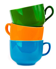 the pile of colorful ceramic mugs