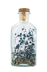 Glass bottle full of herbs