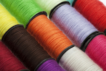 Background made of colorful sewing threads