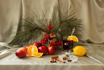 Still life with mulled wine, apple, orange and spices
