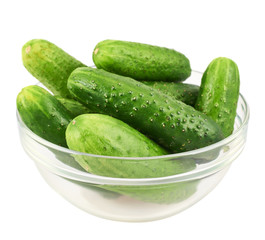 Fresh cucumbers in a glass bowl