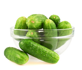 Fresh cucumbers in a glass bowl
