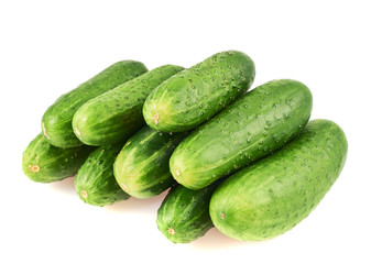 Pile of green cucumbers isolated