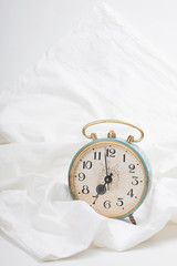 Alarm clock on the bed