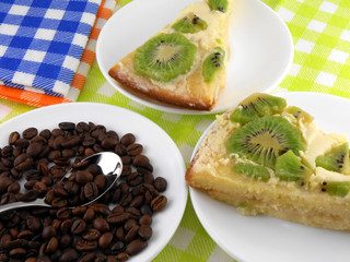 kiwi cake on white plate with coffee beans