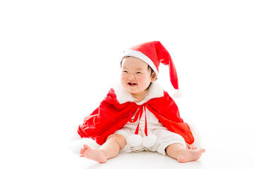 asian baby wearing santa costume on white background