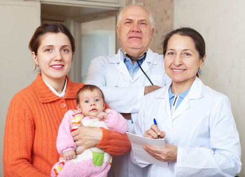 doctors and mother with baby