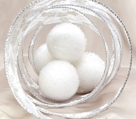White fluffy New Year's balls and decorative tinsel