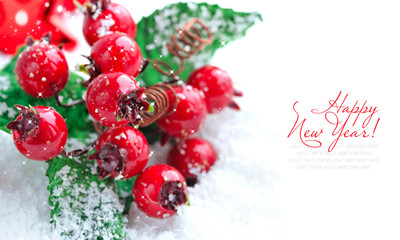 Christmas decorations of bauble on snow with sample text