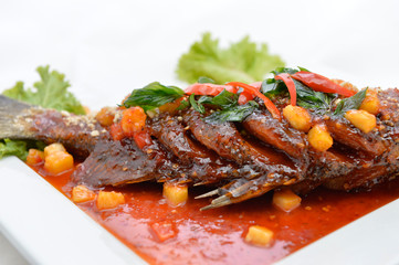 Fried snapper with chili sauce on the plate