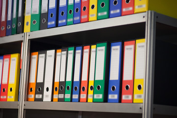 folders on bookshelf