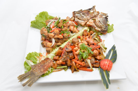 Thai food fried fish with spicy sauce isolated in white backgrou