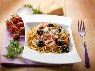 spaghetti with black olives tomatoes and parmesan cheese,selecti