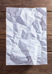 White paper on wood background