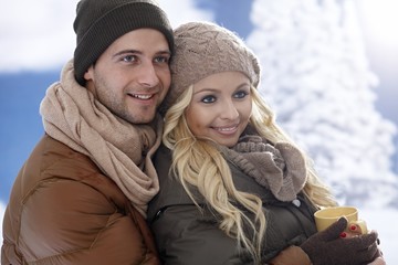 Loving couple embracing at wintertime
