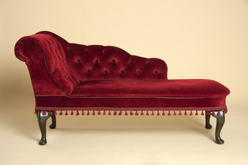 Chaise longue seat covered in a dark red velvet - obrazy, fototapety, plakaty