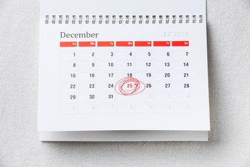 Calendar with 25 December Christmas date with red circle shape m