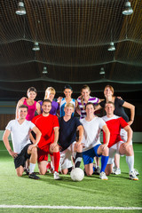 Team playing football or soccer sport indoor