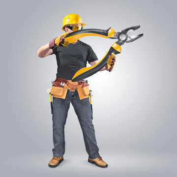 construction worker with tool belt and pliers