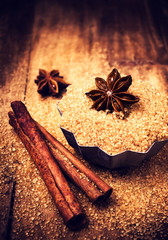Brown sugar and Star Anise in a baking tray on wooden table, sti