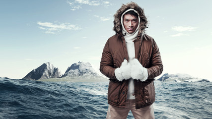 Asian winter sport fashion man in arctic mountain landscape. Wea - obrazy, fototapety, plakaty