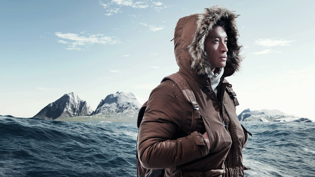 Asian Winter Sport Fashion Man With Backpack In Arctic Mountain