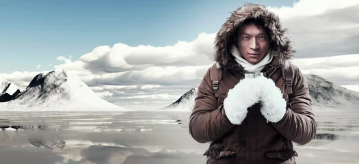 Fotobehang Asian winter sport fashion man with backpack in snow mountain la © ysbrandcosijn