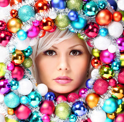 Christmas Woman with Colored Balls. Face of Beautiful Girl
