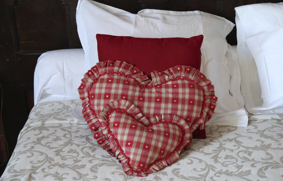 Heart shaped pillows in hotel room