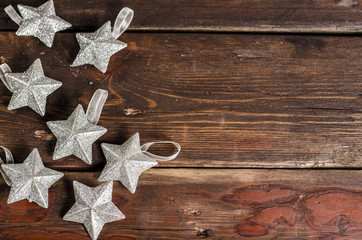 Christmas stars decoration hanging over the wooden background