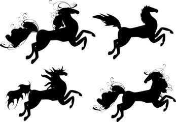 Four black horses - symbol of 2014 year