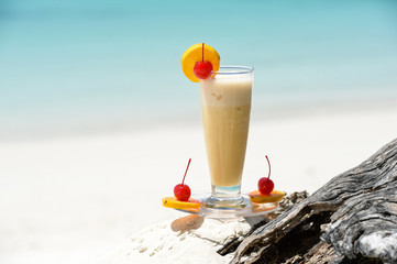 cocktail on the wood at the outdoor against tropic sea beach