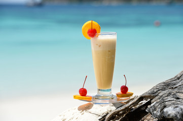 cocktail on the wood at the outdoor against tropic sea beach