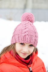 Portrait of child girl in winter clothes